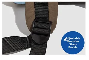 Detail of adjustable black shoulder strap buckle on brown drawstring backpack