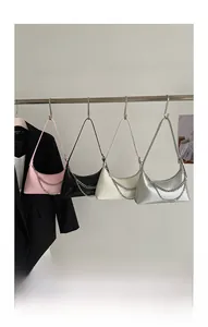 Detailed display of four leather Hobo bags in pink, black, white, and silver with metal chains