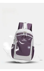 Detail view of lightweight purple and grey Oxford fabric backpack with smooth zippers