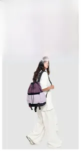 Close-up of a purple drawstring backpack showing waterproof nylon fabric and side zipper pocket