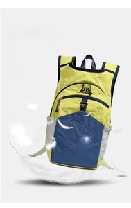 Detail of lightweight color-block outdoor backpack showing nylon fabric and side pocket