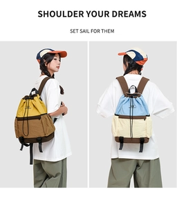 Detail view showing dual-color drawstring backpack features and side mesh pockets