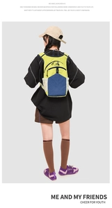 Model wearing a high-capacity color-block sports backpack for travel and fitness use