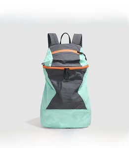 Front view of mint green hiking backpack featuring orange zippers and water-resistant fabric