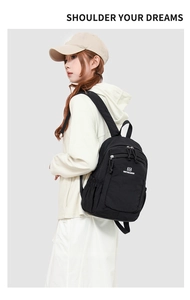 Side view of black minimalist outdoor backpack showing capacity and shoulder straps