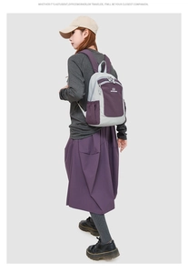Detail view of the breathable padded shoulder straps on the grey and purple backpack