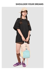 Outdoor cycling backpack in pink, yellow and blue shown with casual street style outfit
