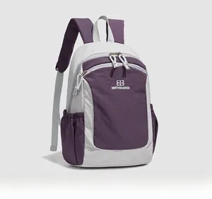 Detail view of purple and grey oxford fabric backpack with Northnansen logo and side pocket