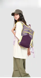 Side view of large purple hiking backpack with neon accents on a female model