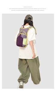Rear view of outdoor double decker backpack in purple and green contrast colors