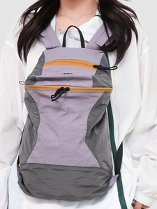 Purple and grey checkered outdoor hiking backpack with yellow zipper for casual travel