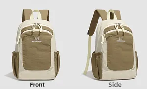 Detail view of two-tone minimalist backpack showing front logo and spacious front zipper pocket