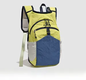 Detail view of contrast color outdoor backpack with breathable mesh straps and side pockets