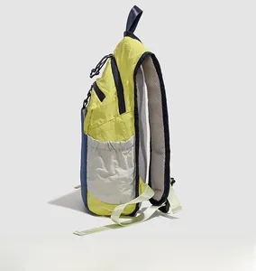Side view of multi-color outdoor backpack showing mesh pocket and padded shoulder straps