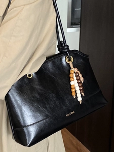 Retro black leather tote bag with beaded charm for women stylish commuter shoulder bag