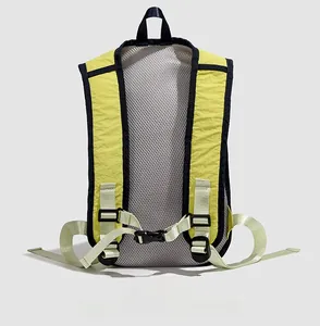 Detail of grey breathable mesh back panel and yellow straps on light outdoor backpack