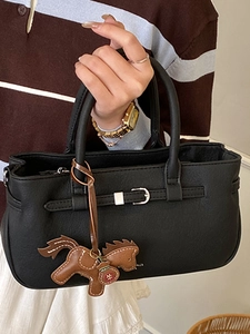Elegant black leather Boston handbag with silver buckle and brown horse charm