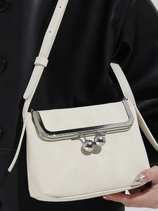 Minimalist creamy white leather crossbody bag with silver clasp closure and chain strap