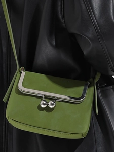Avocado green leather crossbody bag with silver metal frame and double ball clasp design