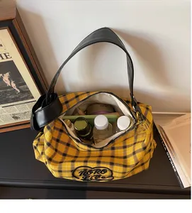 Interior view of large tartan canvas hobo bag showing spacious storage for essentials