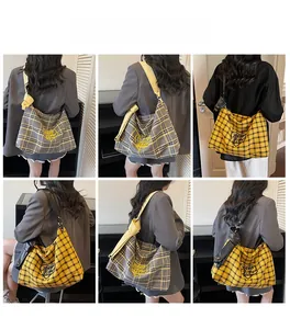 Detailed views of checkered hobo bag with heart embroidery and knotted wide shoulder strap