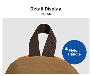 Détail de la poignée supérieure en nylon et du tissu marron clair du sac à dos extérieur