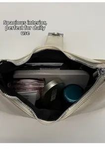 Interior view showing the capacity of the cream crocodile pattern leather shoulder bag