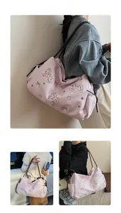 Detailed views of pink embroidered tote bag with cute horse patterns and brown straps