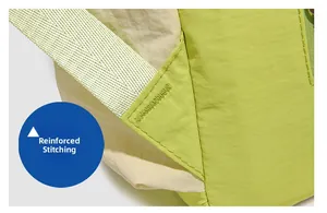 Detail of reinforced bartack stitching on green nylon backpack straps for durability