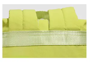 Close-up of fluorescent green travel backpack with reinforced stitching and thick straps