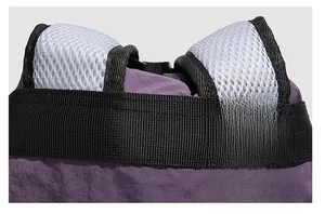 Detail showing high-density stitching and breathable honeycomb mesh on the backpack shoulder strap