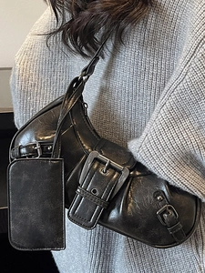 Retro black oversized shoulder bag with silver buckles and Y2K aesthetic vintage style