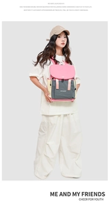 Detail view of colorful drawstring backpack with pink flap and adjustable buckle closure