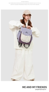 Detail of multi-color casual backpack with flap closure and drawstring side pockets