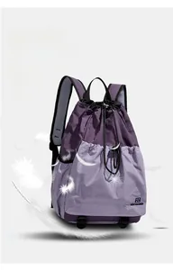 Detail of purple lightweight camping backpack with breathable mesh straps and three pockets