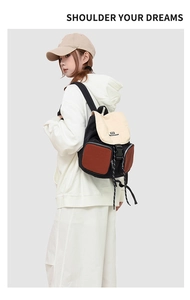Fashionable color-block backpack with adjustable straps worn by a model in casual style
