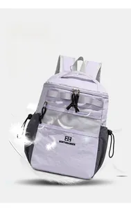 Close-up of lightweight water-resistant purple backpack with white mesh pocket and brand logo