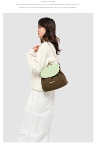 Detail view of the double-decker canvas backpack with green flap and brown body