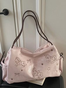 Pink faux leather tote bag with embroidered rocking horses and adjustable drawstrings