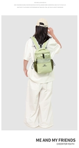 Close-up of lightweight water-resistant backpack with green mesh pockets and side drawstrings