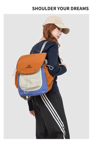Detail view of the drawstring closure and metal buckle on this colorful backpack
