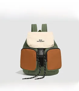 Close-up of color-block nylon backpack featuring olive green, beige, and yellow detail