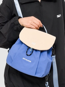 Modern color-block drawstring backpack with adjustable straps and durable nylon fabric