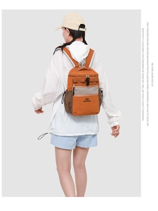 Detail view of water-resistant hiking backpack featuring breathable mesh and side pocket