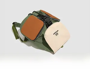 Detail view of the waterproof nylon backpack with contrasting side pockets and buckle