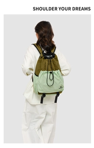 Detail of outdoor backpack featuring drawstring closure and Northmarch brand logo