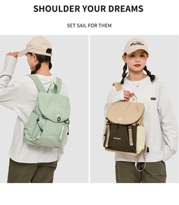 Detail view of stylish drawstring backpacks in light green and khaki contrast patchwork