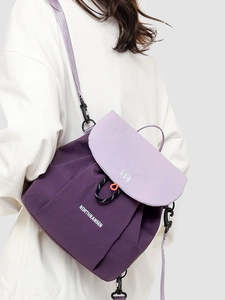 Contrast purple nylon backpack with drawstring closure for casual commuting and travel