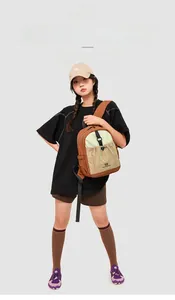 Detailed side view of color-block nylon backpack with adjustable drawstring pockets