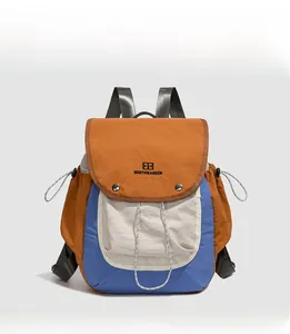 Detailed front view of a vintage multi-color backpack with orange, white, and blue panels